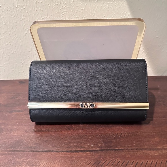 Michael Kors Handbags - Michael Kors Black Clutch with Gold Accent